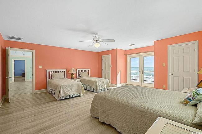 Bedroom featuring visible vents, baseboards, light wood-style flooring, access to exterior, and french doors | Image 32