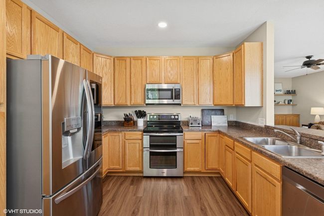 Spacious kitchen with generous cupboard and counter space—perfect for cooking, storage, and entertaining | Image 19