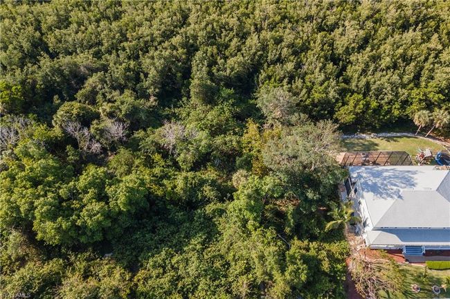 Birds eye view of property with a wooded view | Image 7