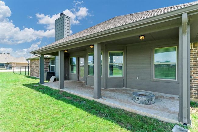 View of terrace featuring a fire pit | Image 30