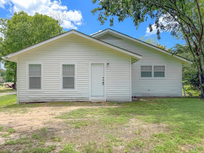 Rear view of property with a lawn | Image 31
