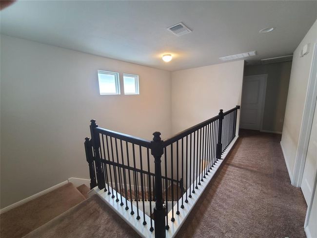 Staircase with carpet floors and baseboards | Image 5