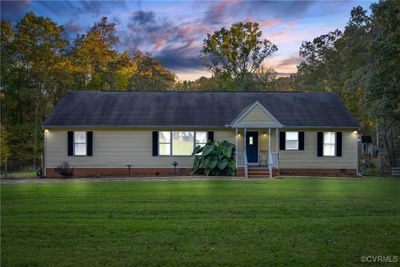 A huge picture window looks out on the large, fenced front yard of your 5 acres of privacy. | Image 1