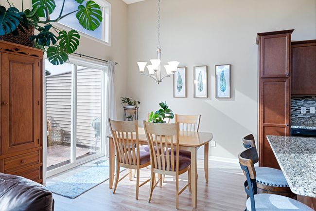 Open concept with great flow from kitchen to living to dining. Huge windows and soaring ceilings let in all the natural light. | Image 10