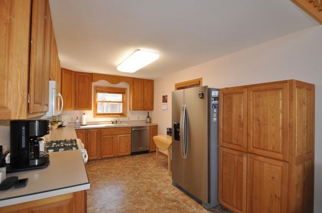Kitchen features lots of cabinet space, appliances are included. | Image 11