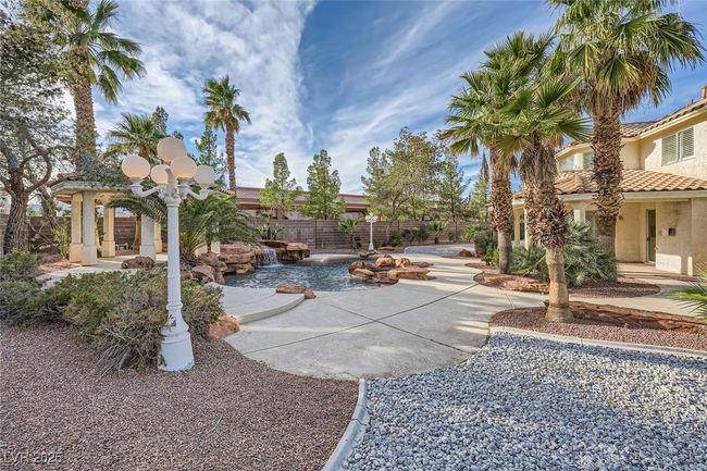 View of yard featuring a patio area and a fenced backyard | Image 53
