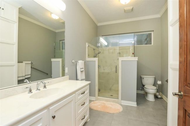 This bathroom is designed for physically older/impaired users. Step/wheel in shower with bench seat, grab bar, and extra long shower hose. All light switches installed at handicapped level (easy from a wheelchair). | Image 28