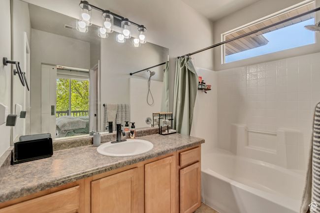 Bathroom with ensuite bathroom, shower / bath combo, and vanity | Image 10