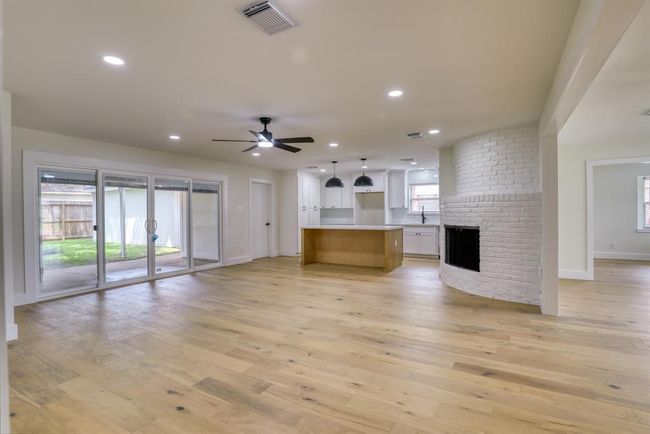Open, light and bright is the ideal. Created with large sliding glass doors and warm, flowing hardwoods. | Image 12
