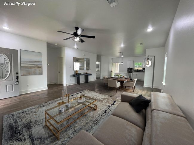Living area with a ceiling fan, wood finished floors, baseboards, and recessed lighting | Image 7