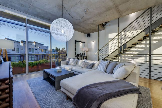 Living room with hardwood / wood-style flooring and expansive windows | Image 9