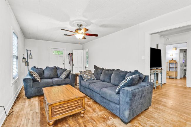 The living area is just off the dining room. | Image 9