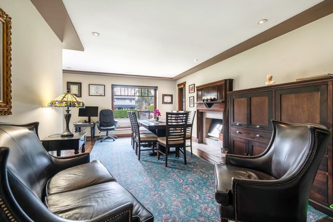Living room with wood finished floors, baseboards, and ornamental molding | Image 6