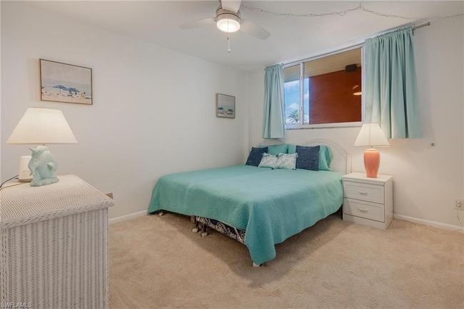Carpeted bedroom with ceiling fan | Image 22