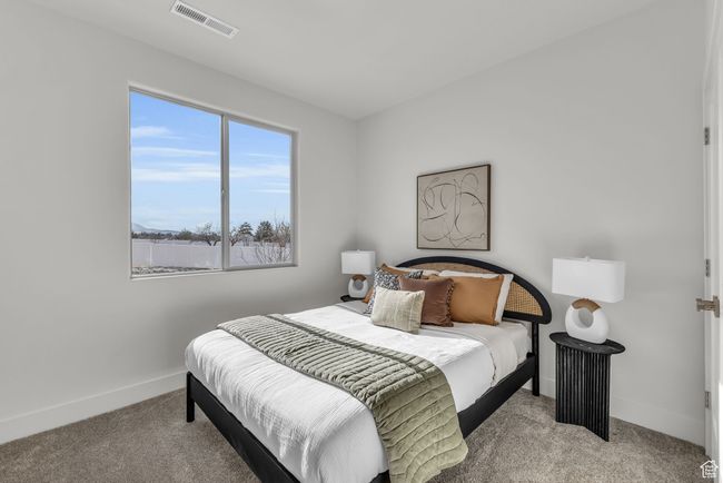 Bedroom featuring light colored carpet | Image 23