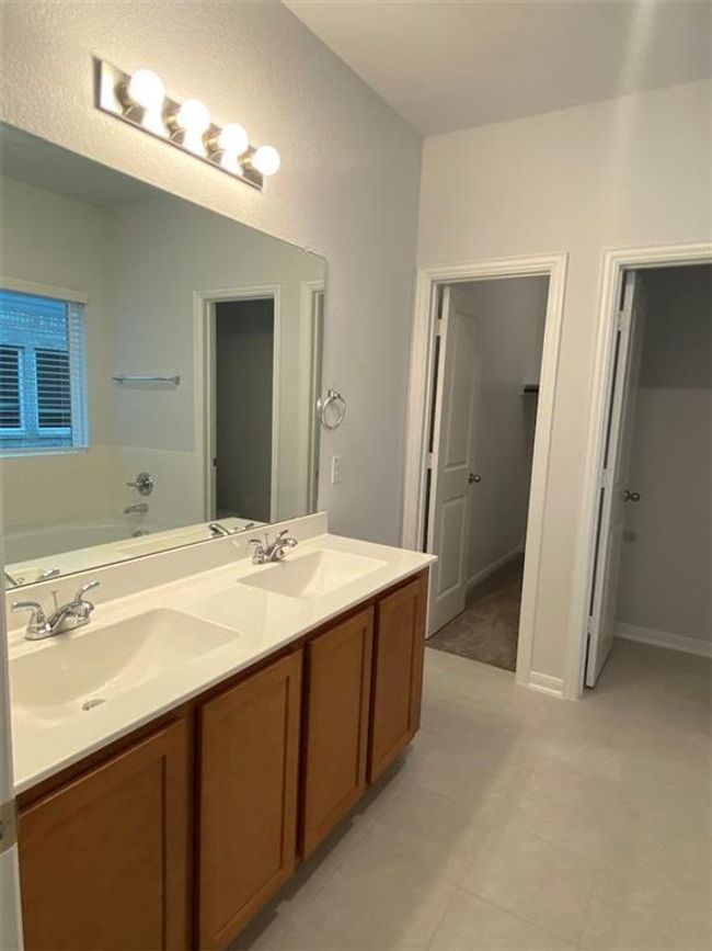 Full bath with double vanity, a garden tub, and tile patterned floors | Image 6