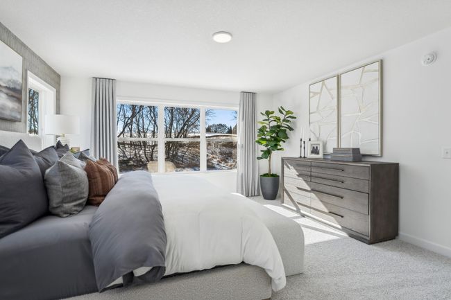 Photo is of the actual model. Another view of the primary bedroom. | Image 20