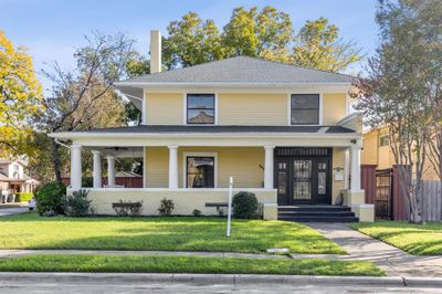 View of front of home with a front lawn and a porch | Image 1