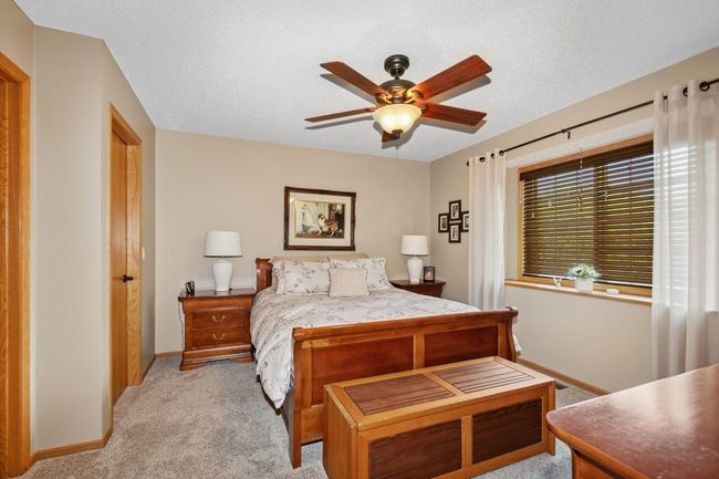 Spacious Bedroom #1 has a ceiling fan | Image 19
