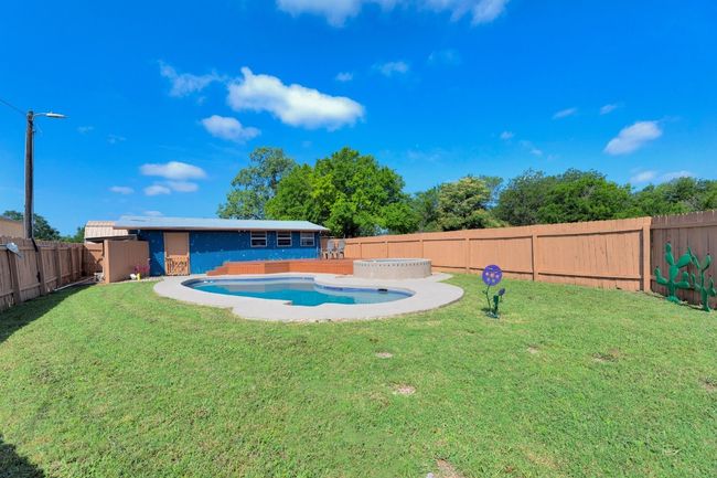 View of pool featuring a fenced backyard | Image 29