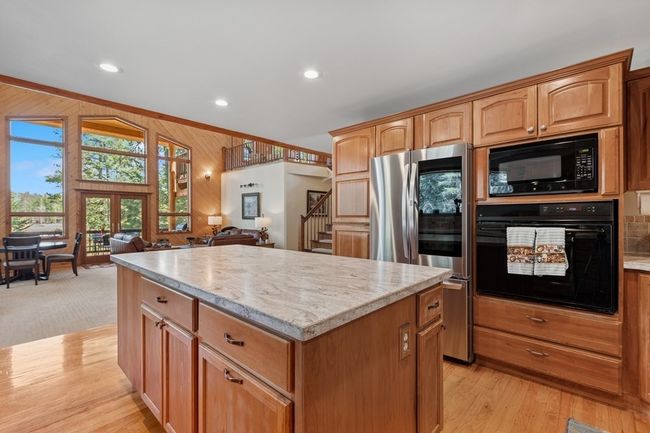 Beautiful flow from kitchen to dining and living area. | Image 41