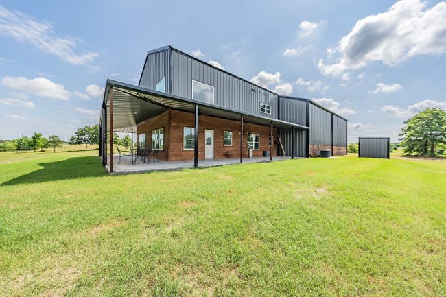 Rear view of house featuring a lawn and a patio | Image 8
