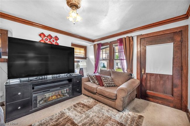 Living room featuring crown molding and carpet flooring | Image 5
