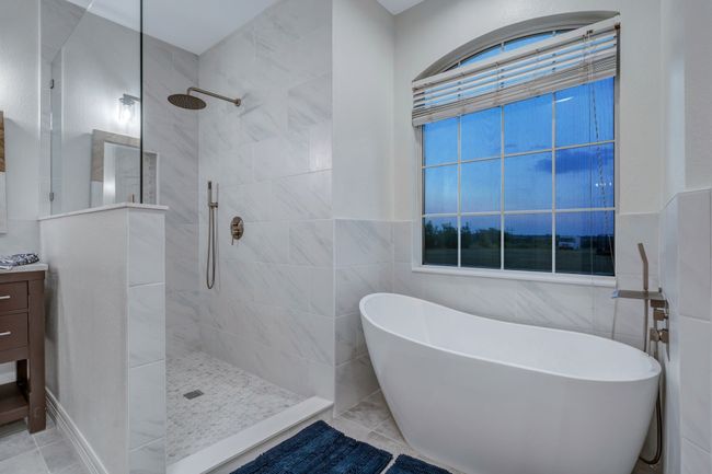 Relish your walk-in shower complete with rainfall shower head and hand shower. | Image 29