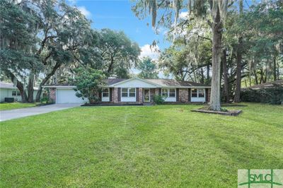 All brick 4 bed, 2 bath with 2 car garage on large lot! | Image 3