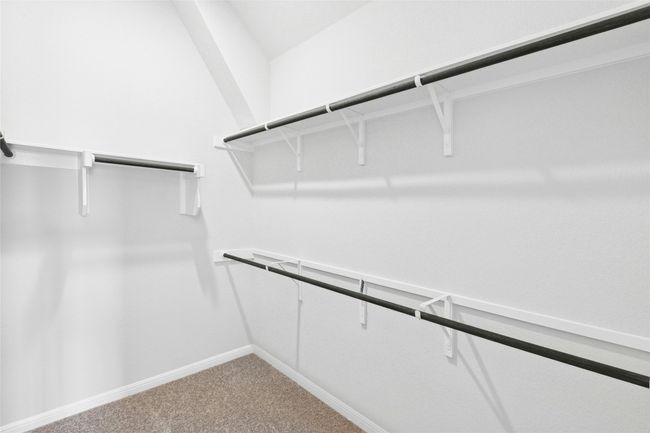 Walk in closet with carpet flooring | Image 13