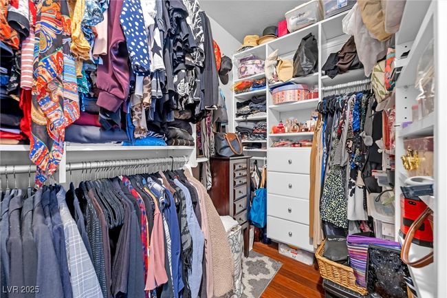 Spacious closet with wood finished floors | Image 17