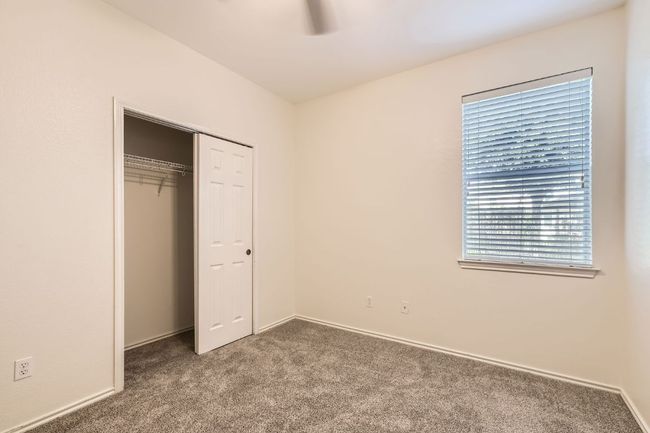 Secondary bedroom downstairs adjacent to a full bathroom - perfect for inlaws or guests. | Image 16