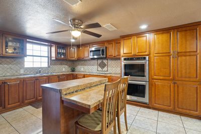 Custom cabinets and breakfast bar | Image 3