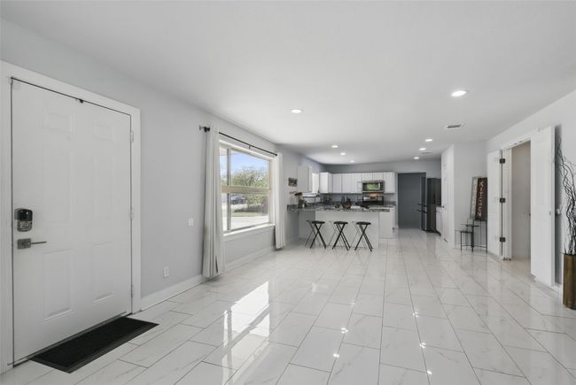 Entrance foyer featuring recessed lighting, baseboards, and light marble finish floors | Image 15