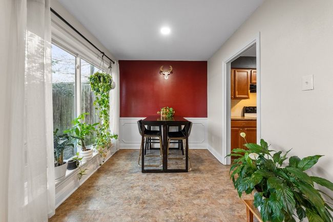 Breakfast area with accent wall, recessed lighting and natural light | Image 11