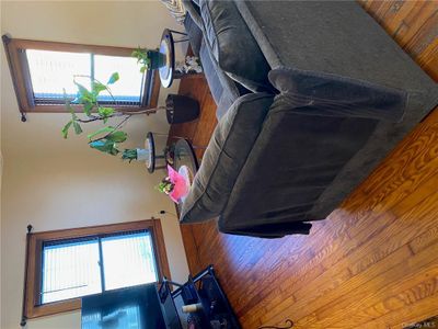 Living room featuring a healthy amount of sunlight and wood-type flooring | Image 3