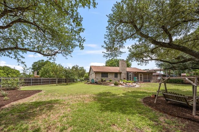 Fenced backyard featuring a sunroom | Image 32