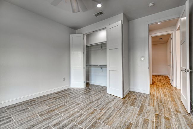Unfurnished bedroom featuring a closet and ceiling fan | Image 19