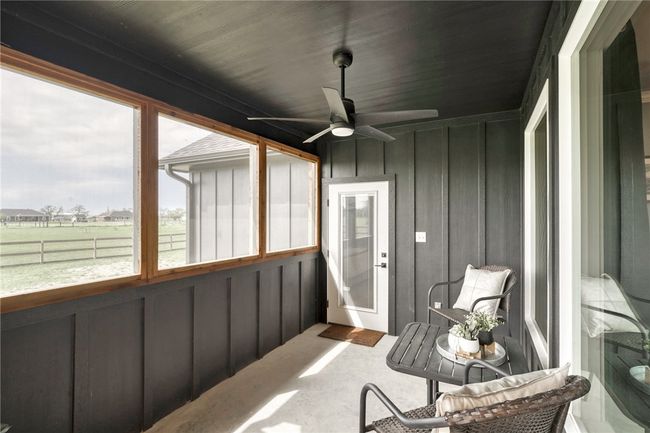 Sunroom / solarium featuring ceiling fan and a rural view | Image 36