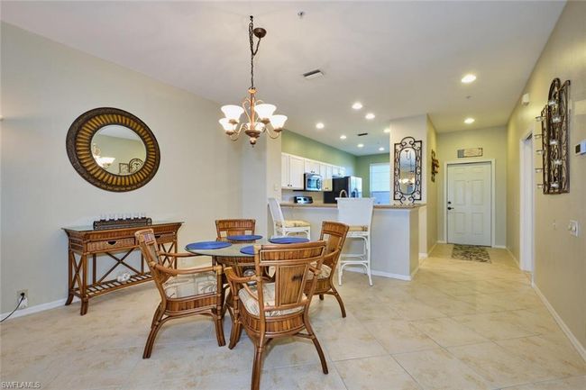 Dining area featuring an inviting chandelier, baseboards, visible vents, and recessed lighting | Image 24