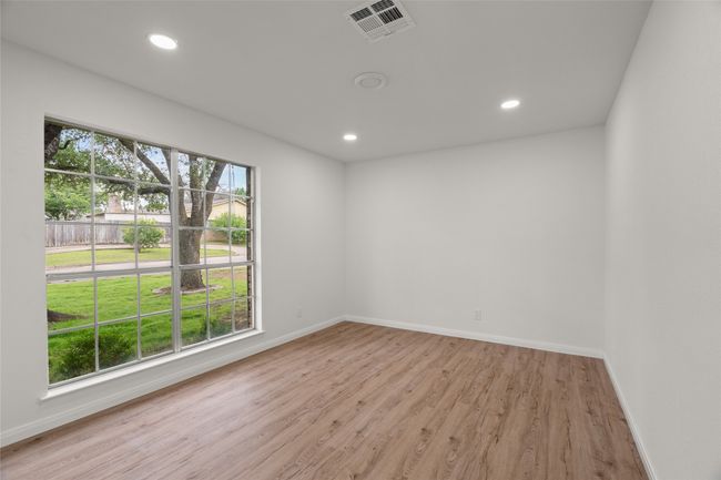 Spare room with light wood-style flooring, baseboards, and recessed lighting | Image 24