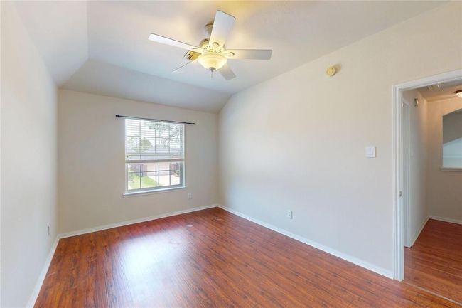 Bedroom 4 upstairs with ceiling fans and laminate | Image 38