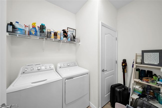 Clothes washing area with washing machine and clothes dryer | Image 21