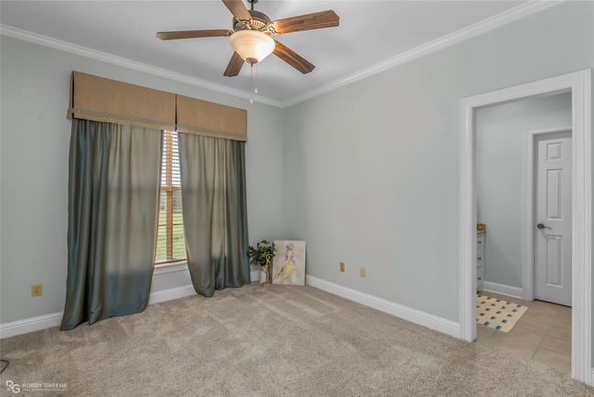 Large bedroom has blackout window coverings for the day sleeper. | Image 25