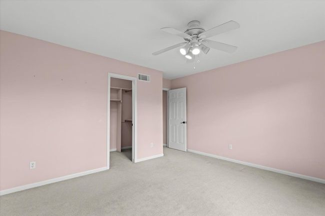 Second larger bedroom with walk in closet, fan | Image 19