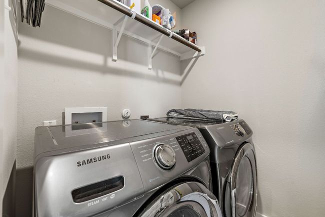 Laundry room upstairs near bedrooms | Image 24