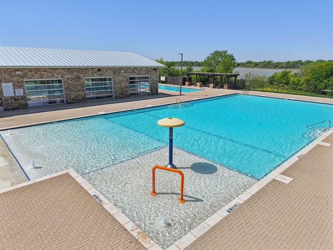 Pool with a patio and fence | Image 36