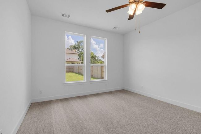 This primary bedroom isn’t just a place to sleep; it’s a space to recharge, dream, and create beautiful memories. | Image 9