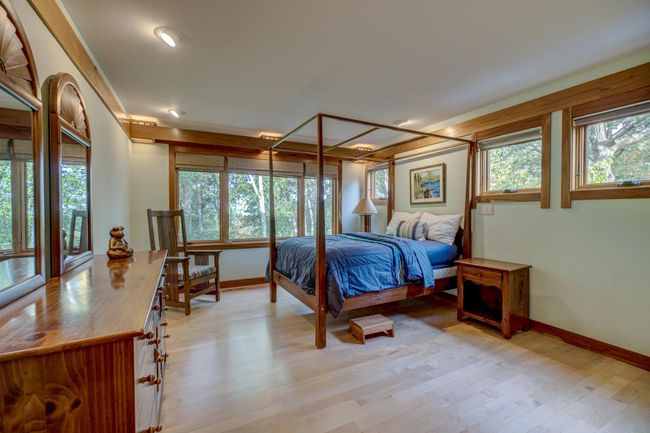 Main floor bedroom, views of the lake and large walk in closet | Image 28