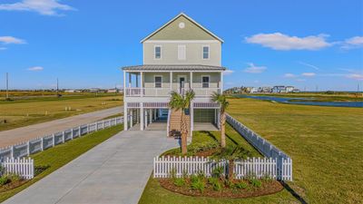 Beautiful landscaping complements the large corner lot. | Image 2